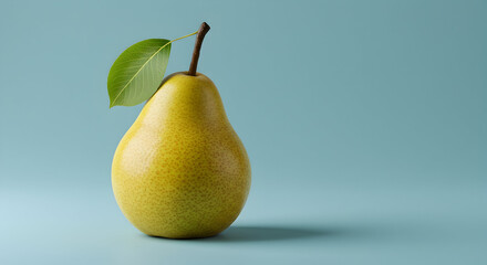 A vibrant yellow pear with a stem and leaf isolated against a pastel blue backdrop