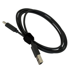 Black USB charging cable with velcro tie isolated on white background