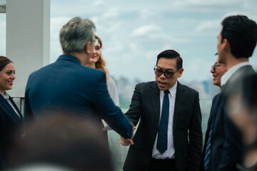 Businessman dealing business success. Executives exchanging ideas in a relaxed outdoor atmosphere, symbolizing innovation, teamwork, and corporate collaboration culture.