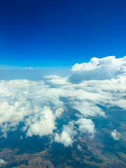 Scenic view over clouds and blue sky during daylight hours from high altitude
