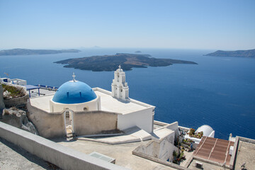 Fototapeta premium Blue Dome and Belfry above the Santorini Caldera, Fira, Greece