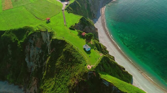 Aerial view of a Ermita de la Regalina on the steep cliffs in Asturias, Spain