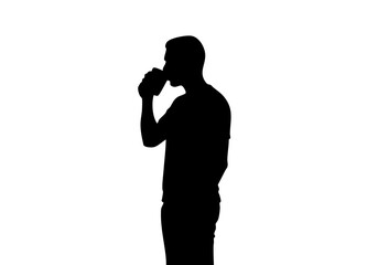 A silhouette of a person drinking from a can.