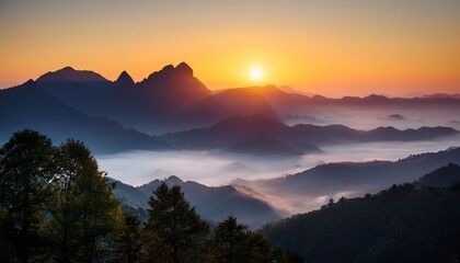 a sunrise over a quiet mountain range with mist