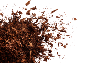 Close-up of scattered dark chocolate pieces on transparent background