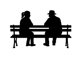 Silhouette of a couple seated on a bench, lost in thoughtful conversation.