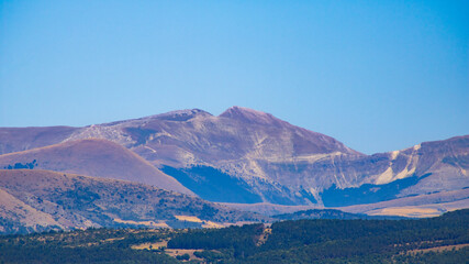Panoramic mountain landscape with blue sky, Italian summer scenery