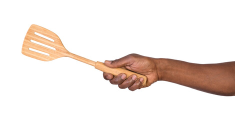 Hand holding a wooden spatula isolated on white or transparent background