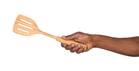 Hand holding a wooden spatula isolated on white or transparent background