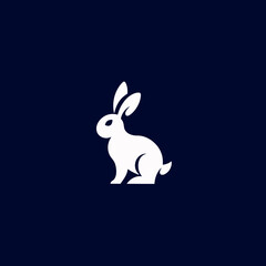 Obraz premium Minimalist white rabbit silhouette on a dark blue background
