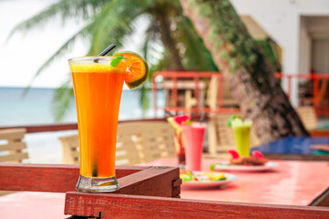 Refreshing Tropical Orange Juice A Vibrant Drink for a Sunny Vacation Day by the Beach