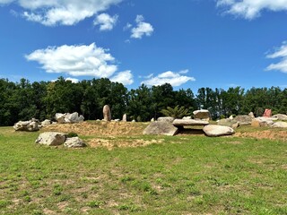 Scenic stone park with unusual rock formations and ornamental tree, a natural attraction near Kharkiv, Ukraine