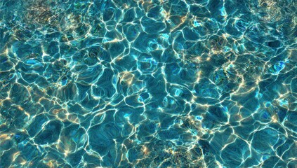 Obraz premium A captivating surface texture of rippled turquoise water, illuminated by sunlight. The intricate patterns of light and shadow create a mesmerizing effect, highlighting the water's depth and movement.