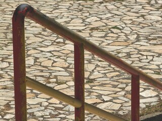 Metal Fence on Stone Surface – Outdoor Close-Up Daytime