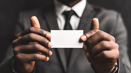 Businessman Holding Blank Business Card In Dark Suit