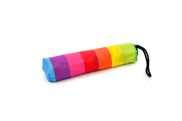 Closed colorful umbrella isolated over white  