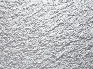 A white concrete textured background showcasing a modern architectural aesthetic with subtle shade variations for a minimalist design.