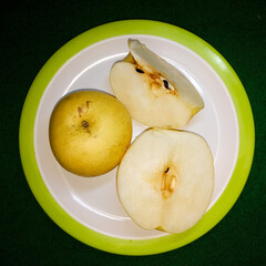 The dark colored core and seeds are clearly visible in the pear slices.