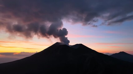 Majestic smoking volcano at dawn with dramatic clouds dawn, travel, caldera - Powered by Adobe