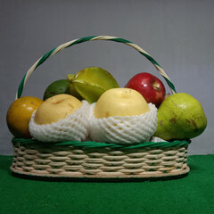 Various vitamin-rich fruits are combined in a parcel basket