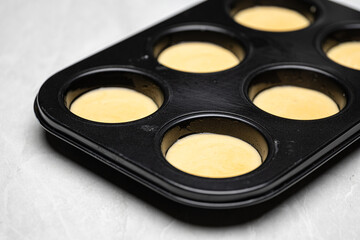 Golden Baked Muffins with Cinnamon and Vanilla in Metal Pan