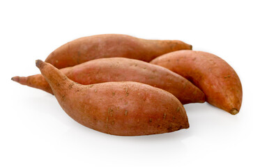 Four sweet potatoes isolated on white background