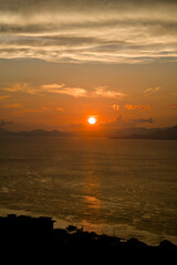 A Stunning Sunset over the Calm and Tranquil Waters of an Island Paradise Landscape