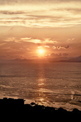 Witness the Stunning Sunset Over the Tranquil Ocean Waters Creating a Beautiful Scene