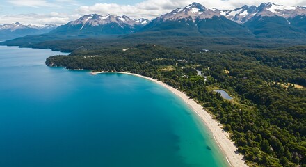 Aerial view of serene lake and mountain range with lush green trees
