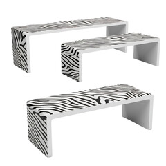 Three modern white benches with zebra print pattern isolated on transparent background