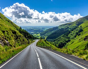Fototapeta premium Winding Mountain Road Through Green Hills