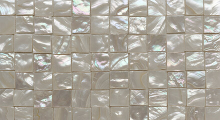 Elegant mother of pearl mosaic tiles create a stunning iridescent surface for luxury bathrooms and kitchens, adding a touch of sophisticated glamour
