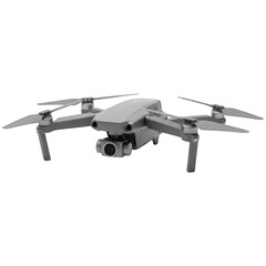 Light gray drone, top-down view, showing body, arms, and camera