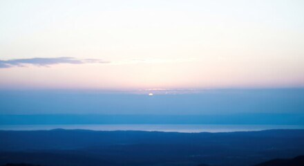 Fototapeta premium Scenic landscape view of horizon at dawn with soft light and blue colors