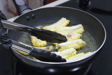 Cooking Fresh Corn on Hot Frying Pan