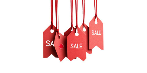 Red sale tags hanging on strings advertising discounts