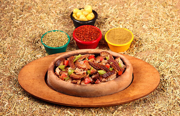 kokorech served mixed with vegetables