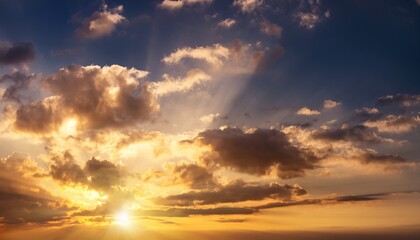 Obraz premium dramatic sky with clouds and golden sunlight abstract banner background