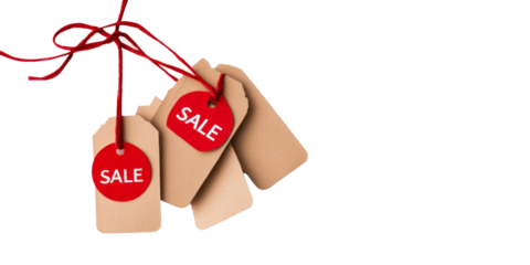 Red sale tags on twine against black background