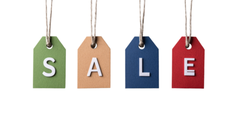 Colorful sale tags hanging against black background