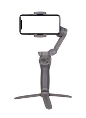 Blank smart phone on a gimbal stabilizer recording horizontal video isolated on white or transparent background 