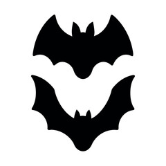 Two silhouetted bats flying against a white background for halloween