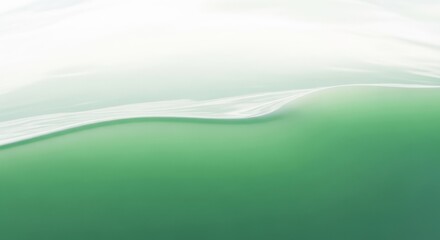 Obraz premium Green water surface with soft natural light and subtle wave.