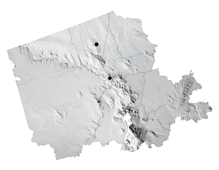 Topographic elevation map portrays detailed geographical features including mountain ranges, valleys, and plateaus, rendered with shades of grey to indicate elevation and relief, and showcasing a...