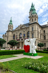 I Love Gyor sign in front of City Hall, Hungary, historic architecture background