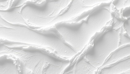 Monochromatic expanse of smooth, creamy texture, showcasing an uneven application of a pure white, slightly textured material