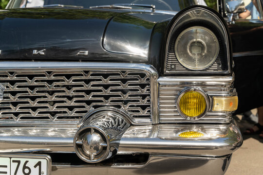 Russia, Sosnovy Bor, July 19, 2025 -Chaika gaz-13, Close-up of chaika gaz-13 grille and headlight, showing soviet automotive design