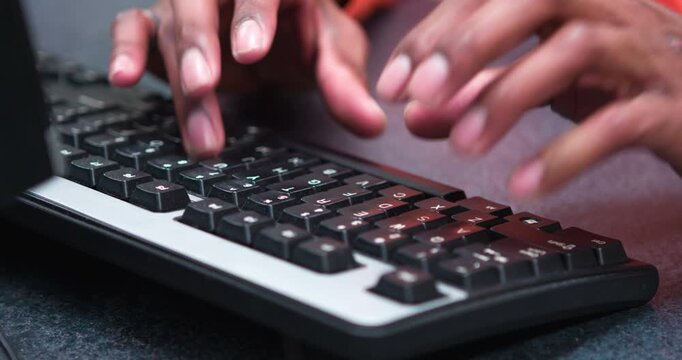 African American hands typing on keyboard 4k