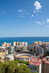 Obraz premium Panoramic view of coastal city with bullring and sea