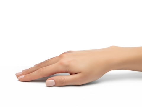 Elegant female hand resting gently with natural nude manicure, symbolizing simplicity, beauty, care, grace, and sophistication over a white table
